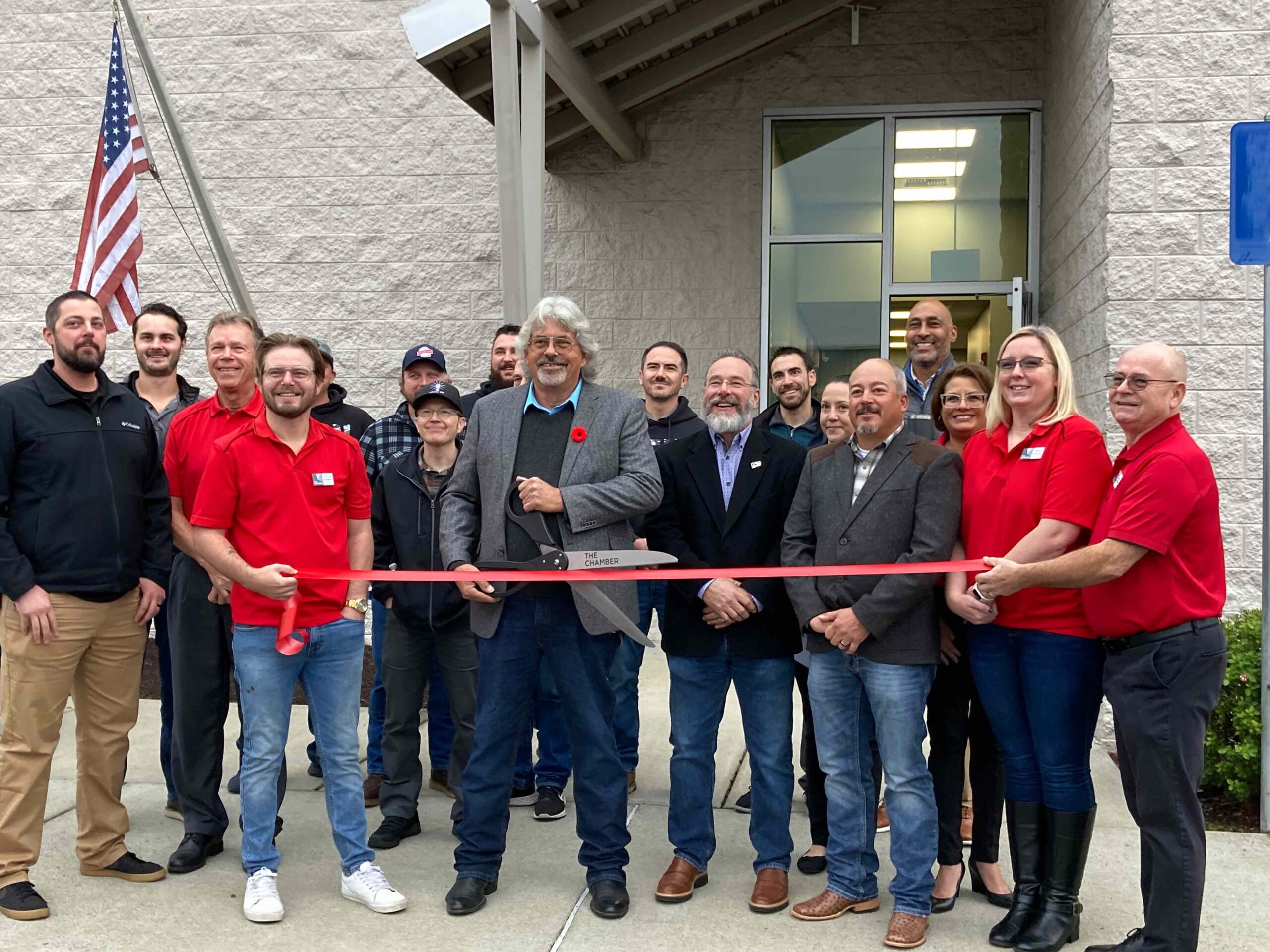 people in line about to cut ribbon for Southern Oregon Builds